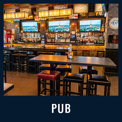 Spacious pub with high tables, bar seating and multiple TVs above a fully stocked bar