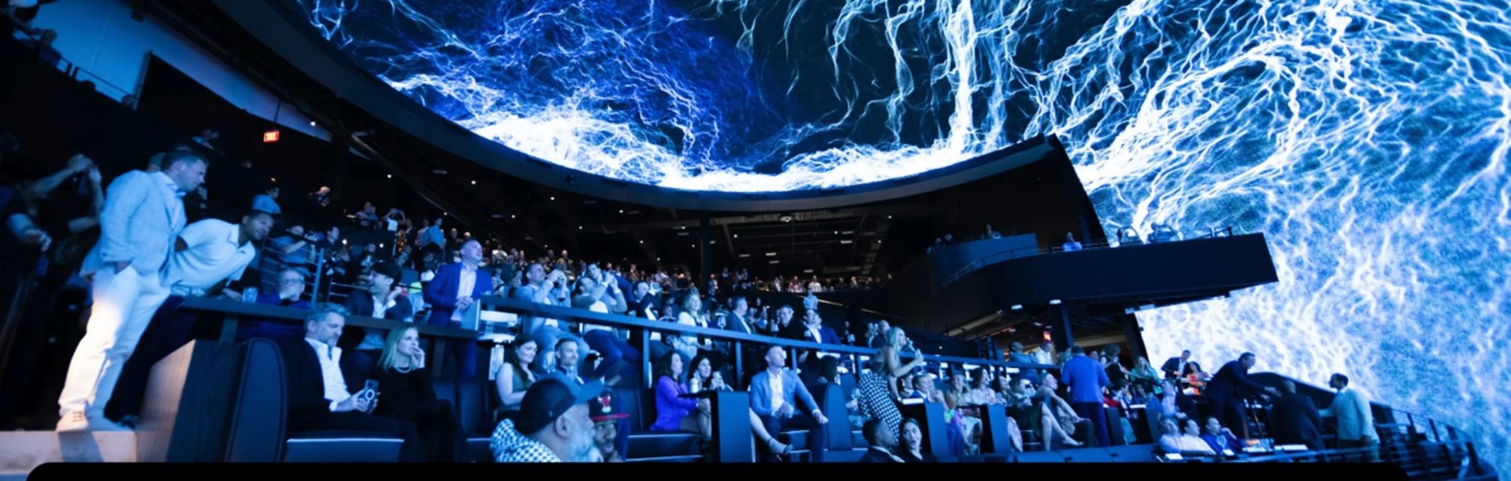 Packed seats for a show in the Dome at Cosm